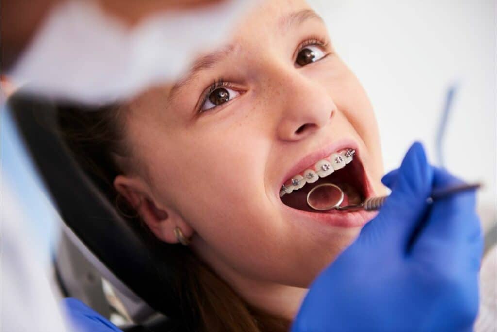 Kid with braces at the dentist