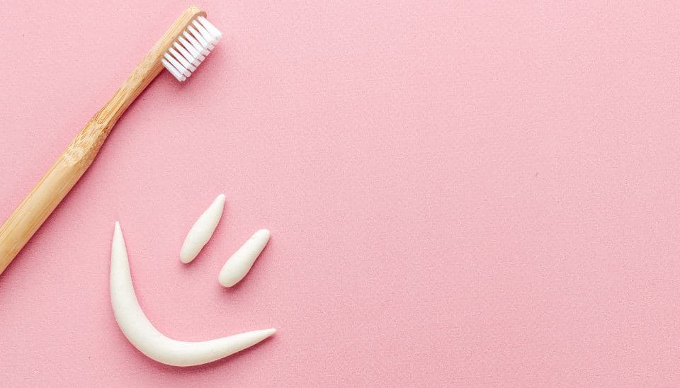 Sustainability in Dental Practices - Bamboo Toothbrush and smiley face